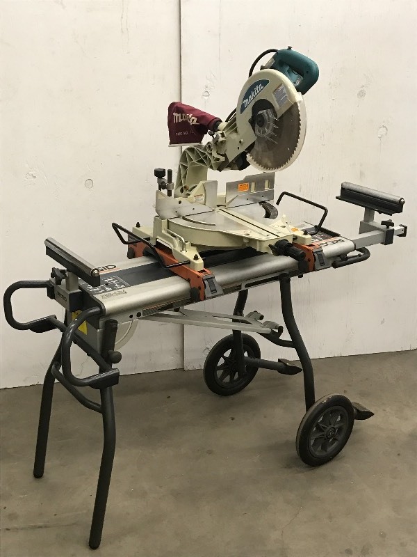 lot 1 image: Makita Compound Miter Saw With Stand