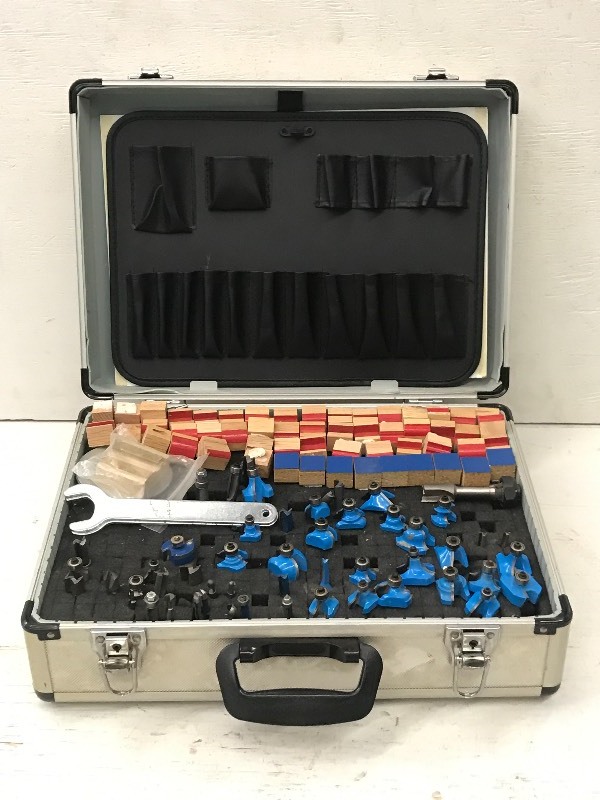 lot 21 image: Aluminum Toolbox With Assorted Router  Shaper Bits