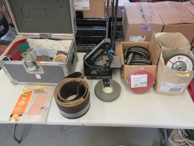 lot 122 image: DELTA BELT SANDER, WHEELS AND PAPER
