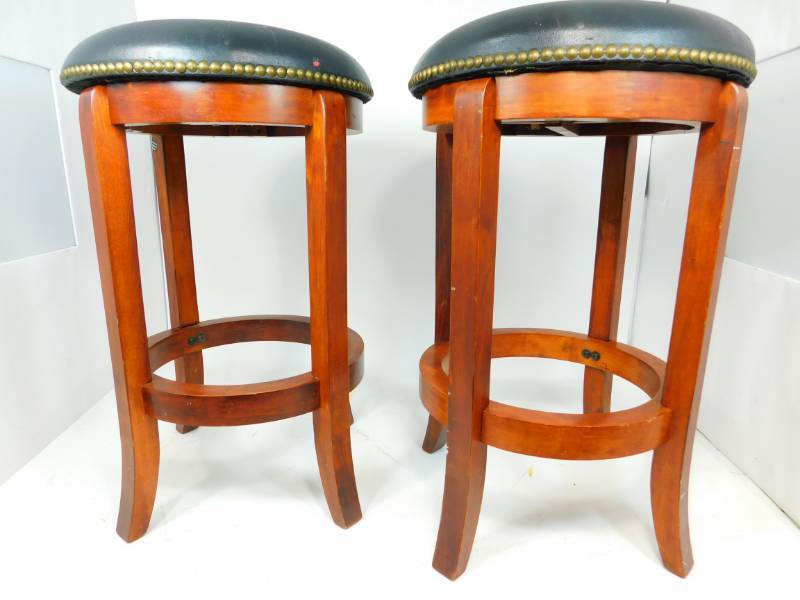 lot 11 image: Two Swivel  Stools With Black Leather Padded Seats