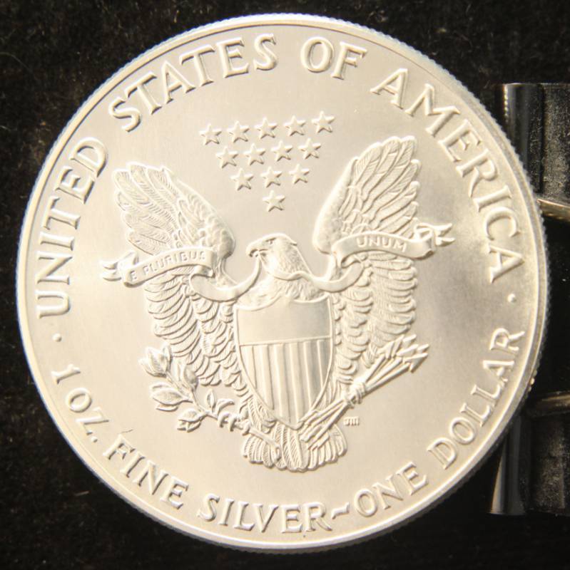 lot 10 image: 1987 AMERICAN SILVER EAGLE 1 TROY OZ. .999 FINE SILVER DOLLAR