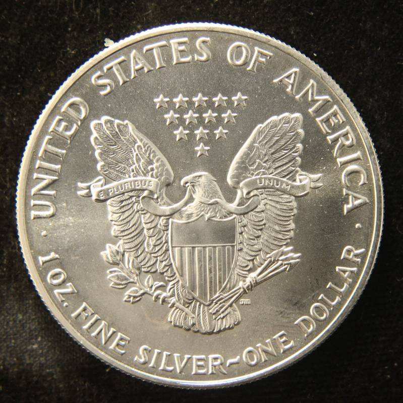 lot 52 image: 1991 AMERICAN SILVER EAGLE 1 TROY OZ. .999 FINE SILVER DOLLAR