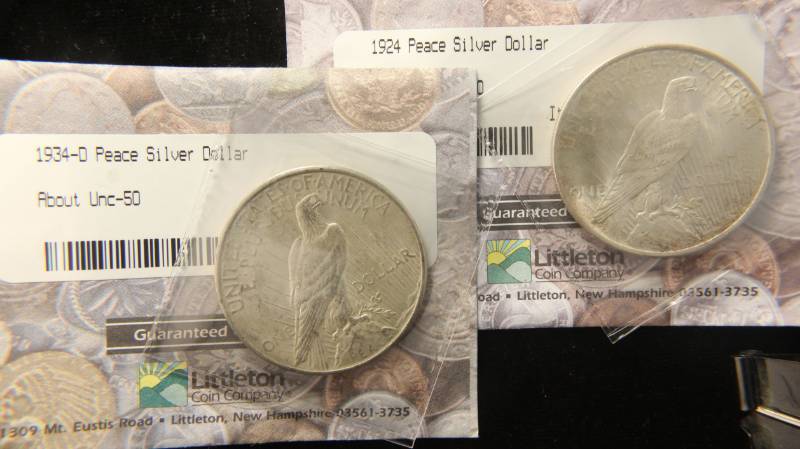 lot 77 image: 2 SILVER DOLLARS 1924 UNC & 1934-D AU BOTH IN ORIGINAL LITTLETON PKG