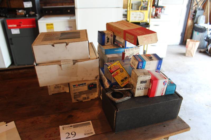 lot 1 image: Car w Parts - Master Cylinder, Thermostat, Water Pump, Distributor Cap, And More