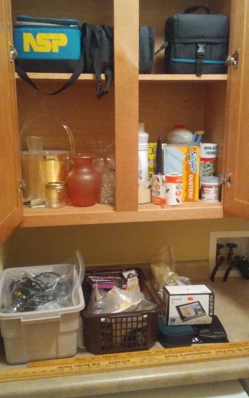 lot 42 image: Contents Of Utility Room Cabinets Cleaning Products, Light Bulbs, Yard Sticks, Lunch Boxes, Garmin, More