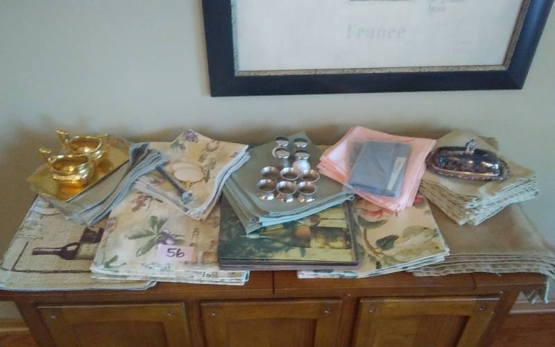 lot 56 image: Table Linens Placemats, Cloth Napkins, Napkin Rings, Cream & Sugar Set, Salt & Peppers, Covered Butter Dish, Silver Polishing Cloths, More