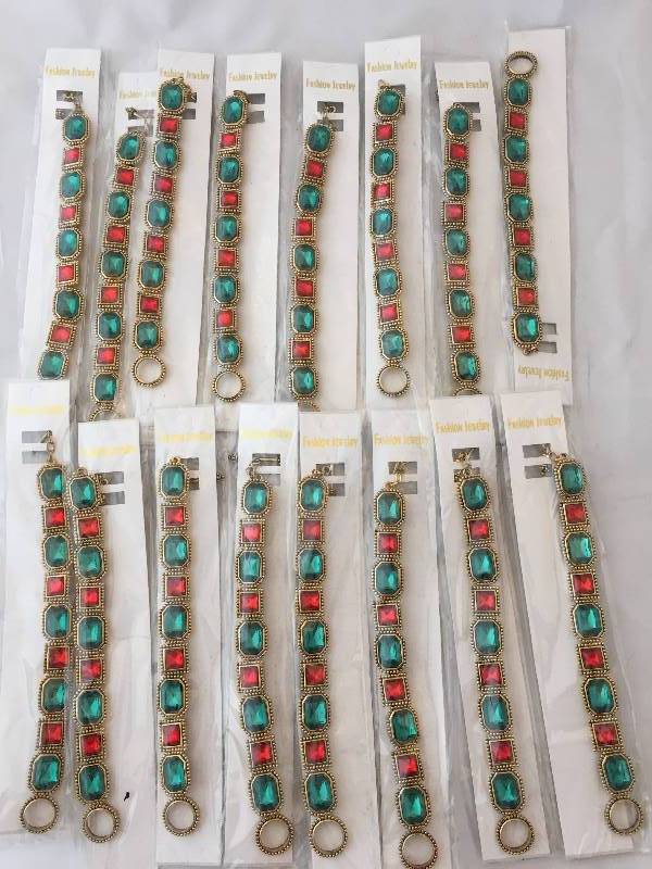 lot 230 image: Bracelets - New in Package - Red & Green Stones Gold Metal