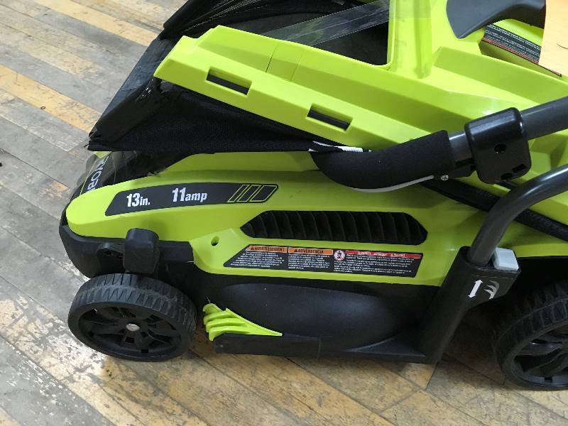 lot 33 image: Ryobi 13 in. 11 Amp Corded Electric Walk Behind Push Mower in working conditions