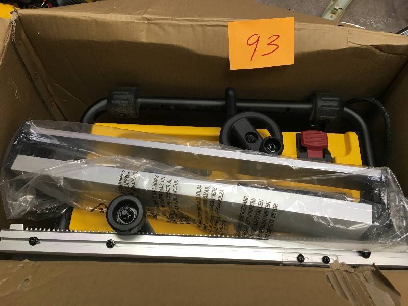 lot 93 image: Dewalt 15 Amp 10 in. Compact Job Site Table Saw with Site-Pro Modular Guarding System in working conditions