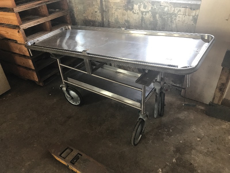 Tilting stainless autopsy table