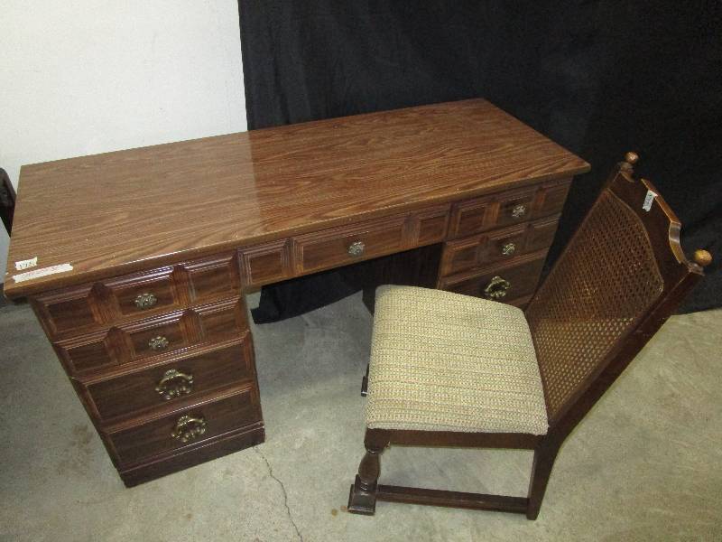 lot 27 image: 8 Drawer Desk and Chair, Desk is 54 X 20 X 30