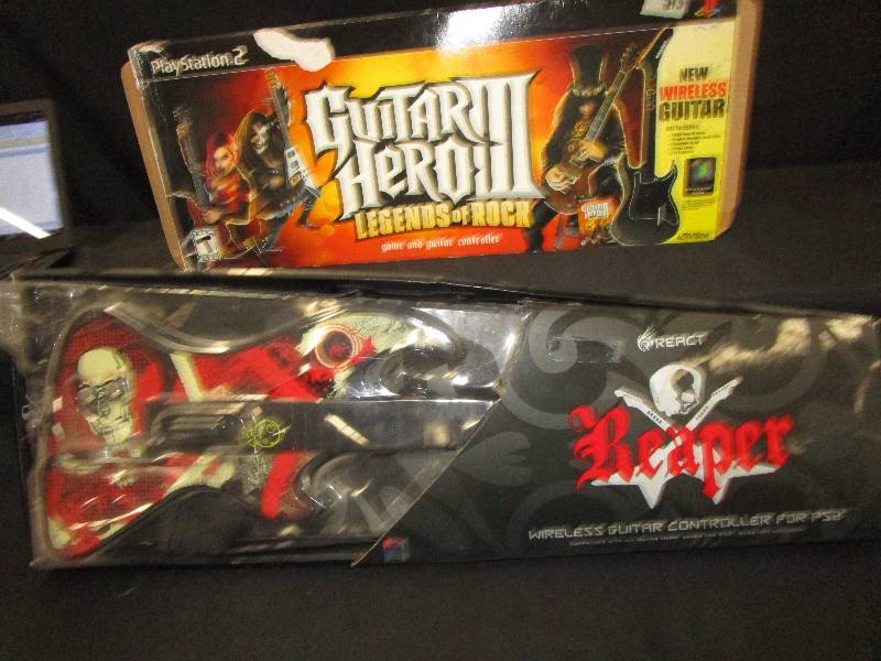lot 112 image: Wireless Guitar Controller for PS2 and Wireless Guitar for Guitar Hero 3