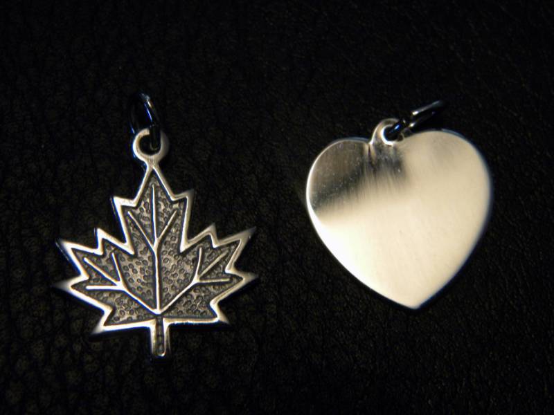 lot 35 image: 2 Sterling Silver Pendants