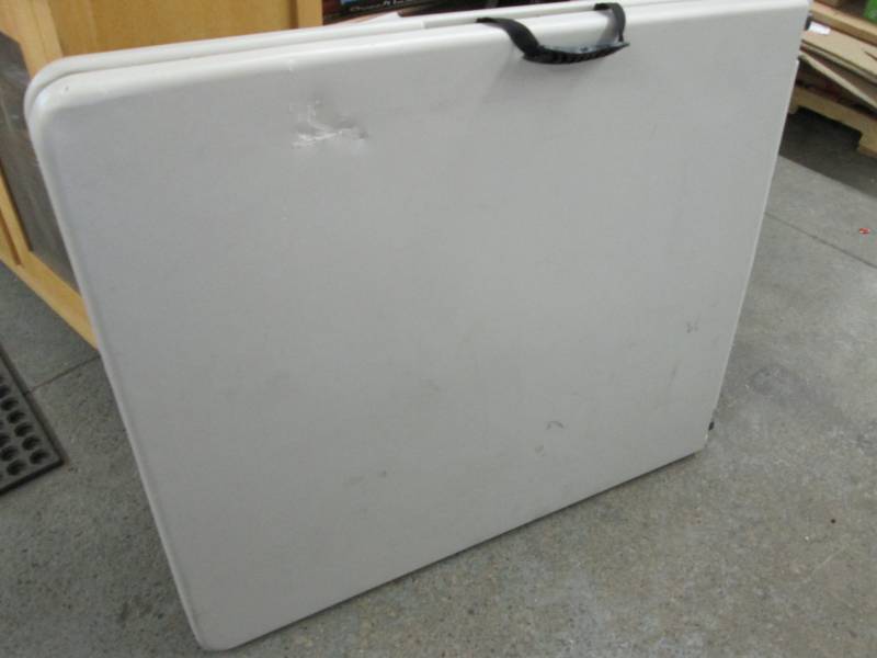 lot 50 image: Tan 6 ft Folding Table damaged...