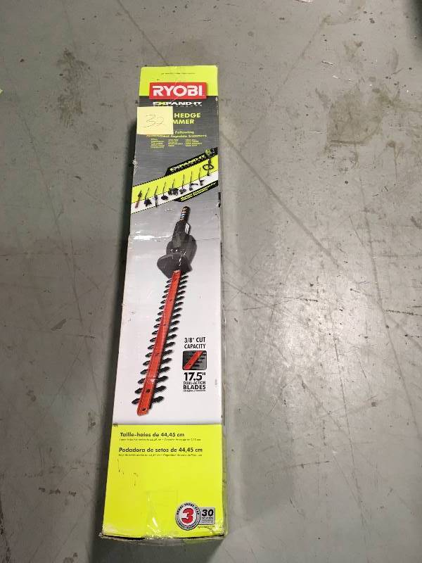 lot 32 image: Ryobi Expand-It 17-12 in. Universal Hedge Trimmer Attachment in good conditions