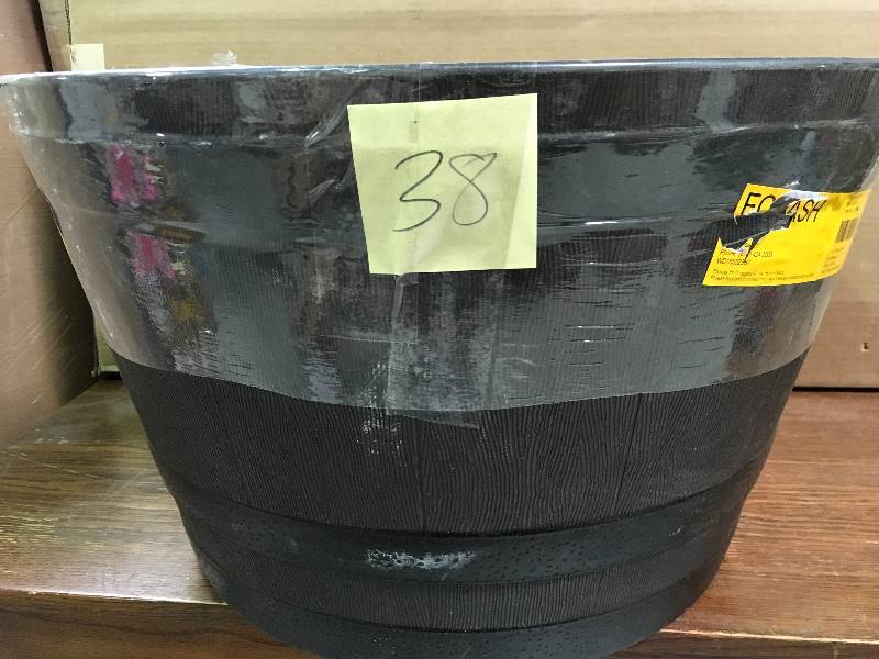lot 38 image: Rustic Oak Whiskey Barrel Planter with Iron Band 25 in. Dia. in good conditions