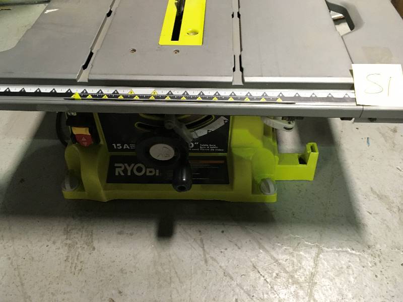 lot 81 image: Ryobi 10 in. 15 Amp Table Saw in working conditions whit folding stand