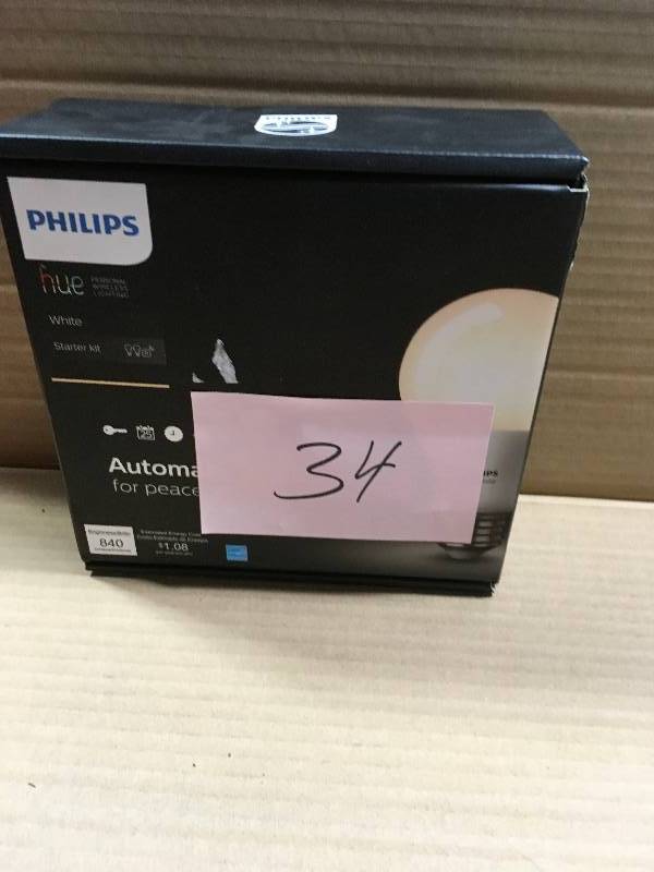 lot 34 image: Philips Hue White A19 60W Equivalent Dimmable LED Smart Bulb Starter Kit (2 A19 60W White Bulbs and 1 Hub in good conditions
