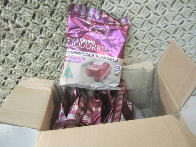lot 154 image: Case with 7 Bags of Cherry Cola Fla...