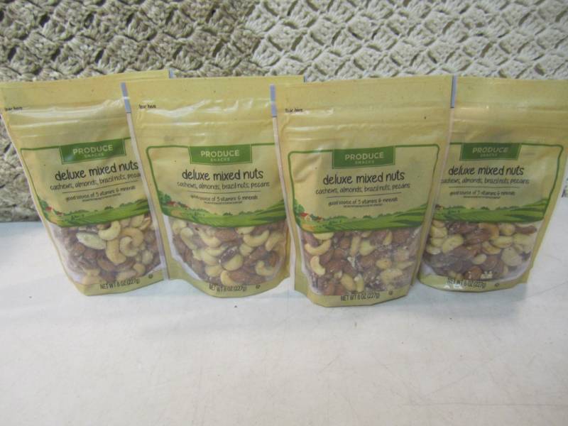 lot 233 image: 4 Bags of Deluxe Mixed Nuts Best by...