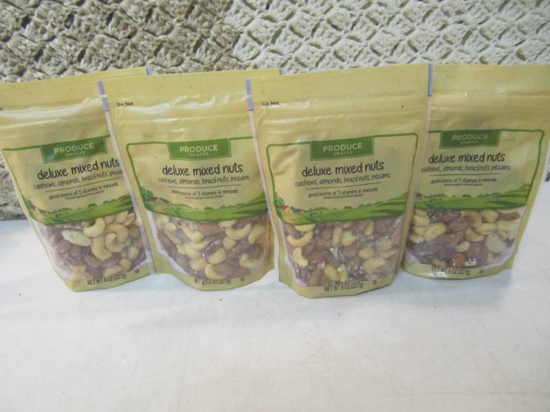 lot 234 image: 4 Bags of Deluxe Mixed Nuts Best by...