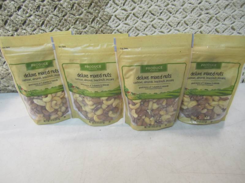 lot 235 image: 4 Bags of Deluxe Mixed Nuts Best by...