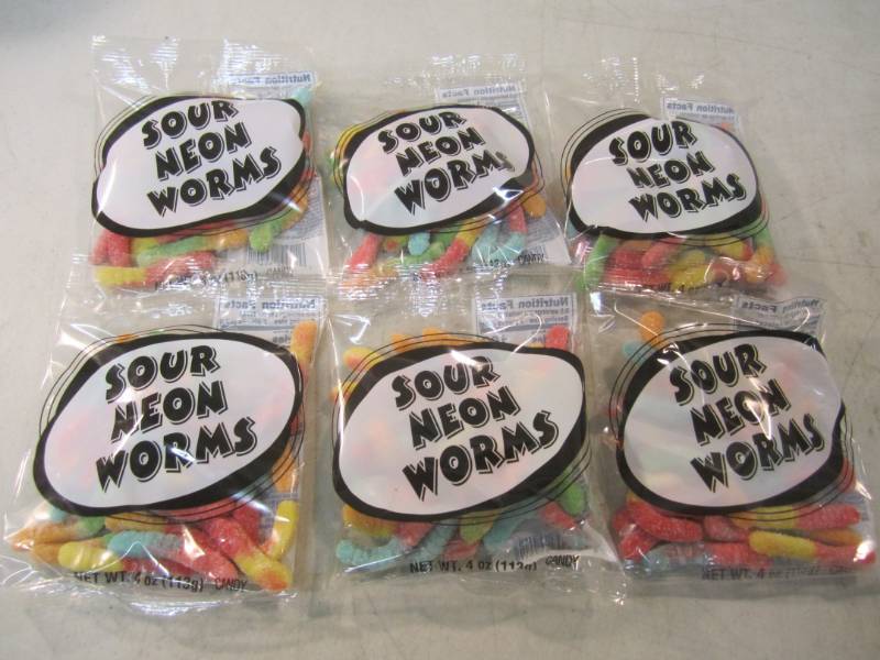 lot 290 image: 6 Bags of Sour Neon Worms Best by F...