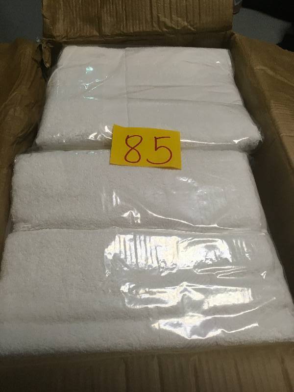 lot 85 image: A Case of Quantum Mills White  Bath Towels 27 X 54 New total 24 pc