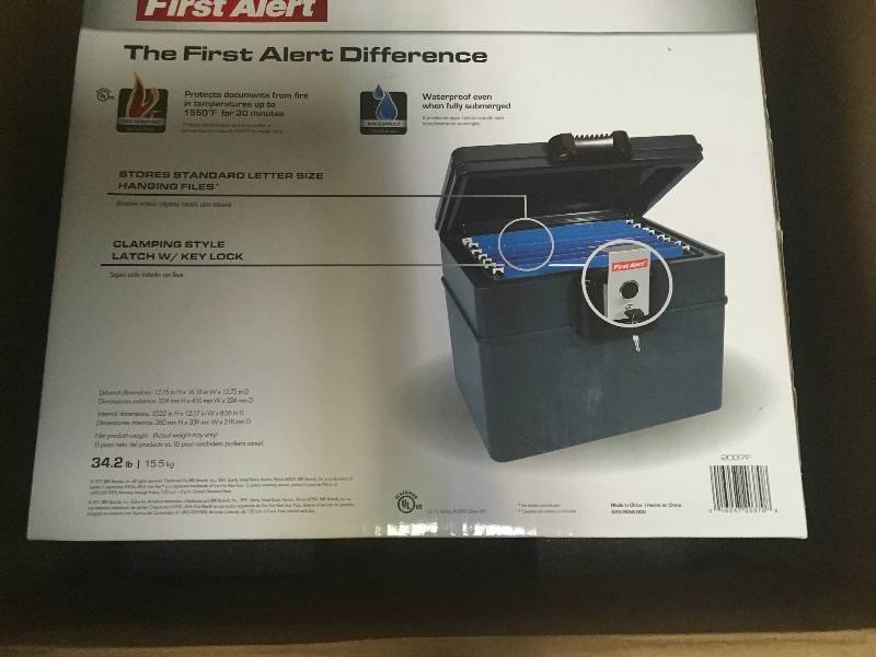 lot 92 image: First Alert 0.62 cu. ft. Capacity and Durable Construction Safe in good condition