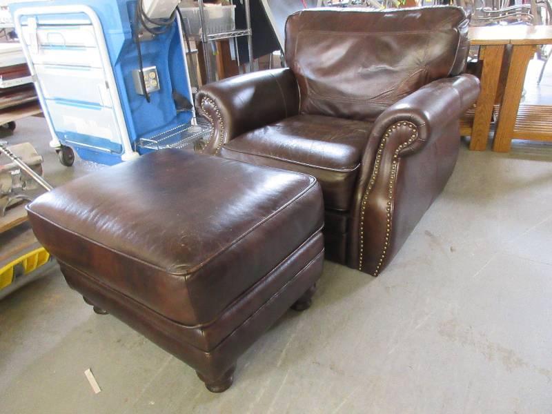 lot 134 image: BROWN LEATHER CHAIR WITH OTTOMAN