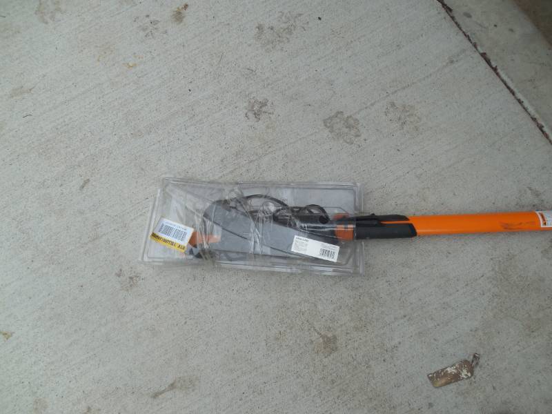 lot 56 image: Fiskars PowerLever 1-18 in. Cut Capacity Steel Saw Blade 15 in. Fiberglass Pole 14 ft. Tree Pruner