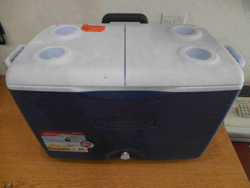 lot 23 image: Rubbermaid 60 Qt. Wheeled Cooler