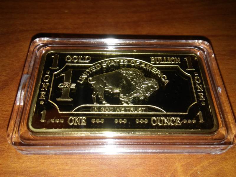 lot 493 image: NDSU Bison 1 Troy Oz.  gold bullion 100 mills, .999 fine gold. Gold plated