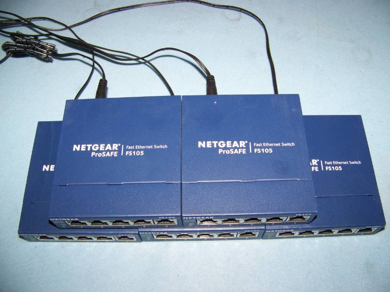 lot 44 image: (5) NetGear, ProSAFE, Fast Ethernet Switches with Power Supplies