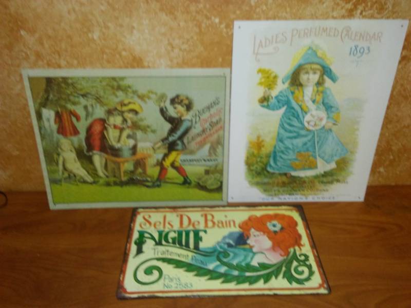 lot 93 image: 3 metal soap and fragrance signs.