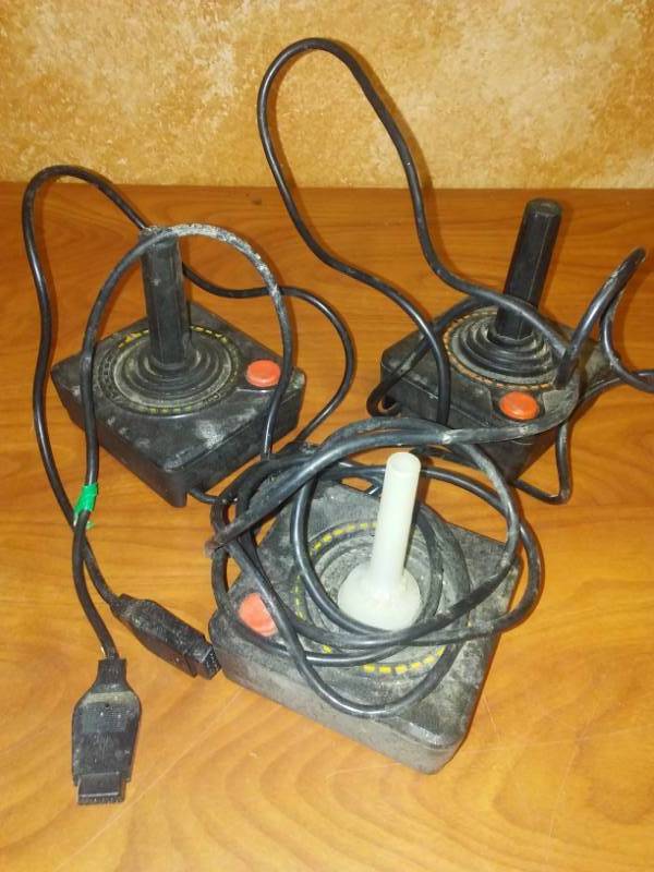 lot 99 image: Atari, Sears 2600 game controllers rare and all there