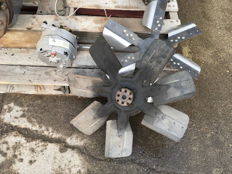 lot 96 image: New Chevy Alternator & 2 Fan Blades