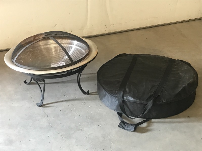 lot 43 image: Portable Fire Pit With Padded Zippe...