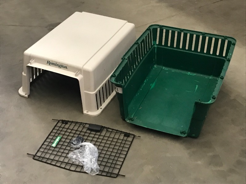 lot 81 image: Remington Mid-Sized Pet Travel Kennel  Complete---Has A Small Crack On One Side---Still Usable