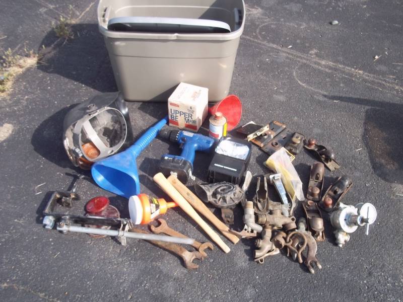 lot 42 image: Tote with Cordless Drill, Work Light, Funnel, Welding Mask, Misc.