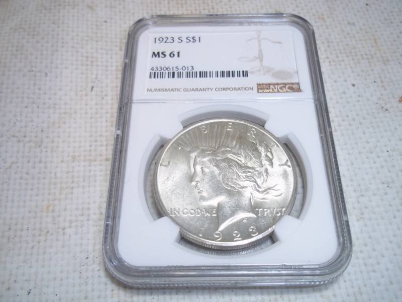 lot 6 image: 1923 S Graded Peace Dollar in Case. MS61