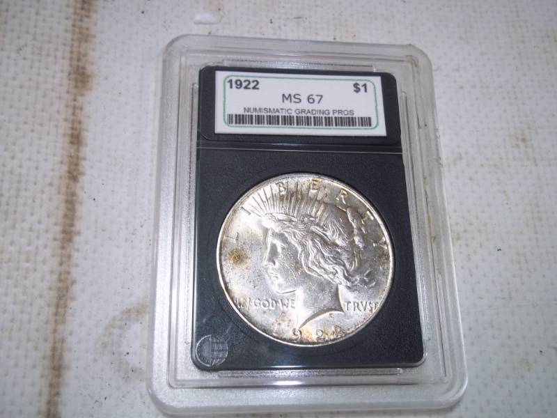 lot 10 image: 1922 Graded Peace Dollar in Case. MS67