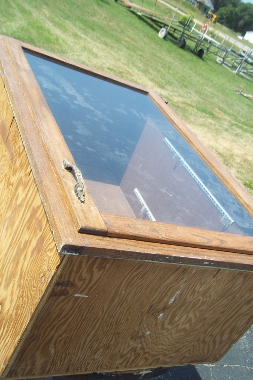 lot 79 image: Wood Cabinet with Glass Door. 26 x 38