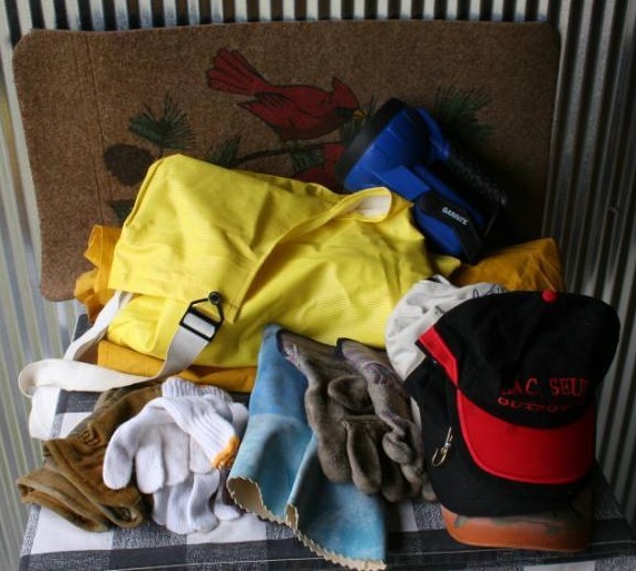 lot 26 image: Outdoor Apparel, Flashlight, and Door Mat