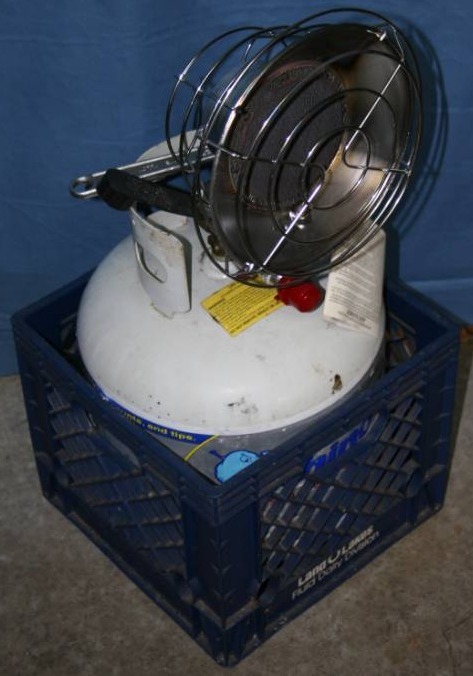 lot 151 image: Propane Tank with Sunflower Heater Attachment