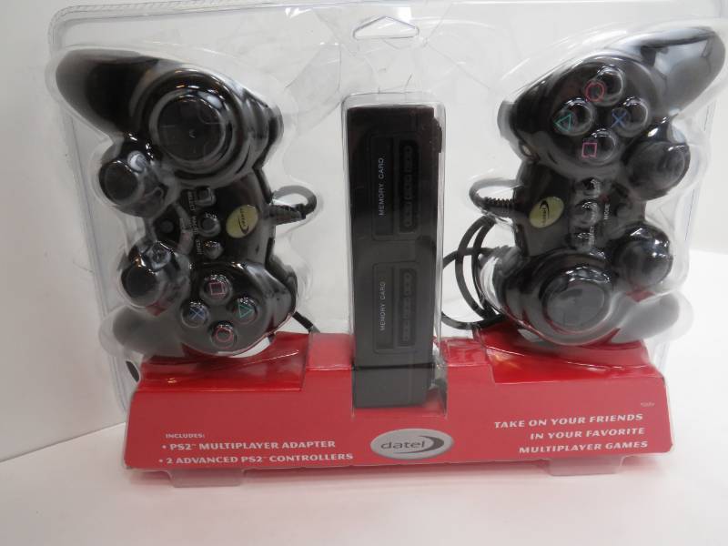 lot 26 image: Dual controller for the PS2 with a PS2 Multiplayer adapter included