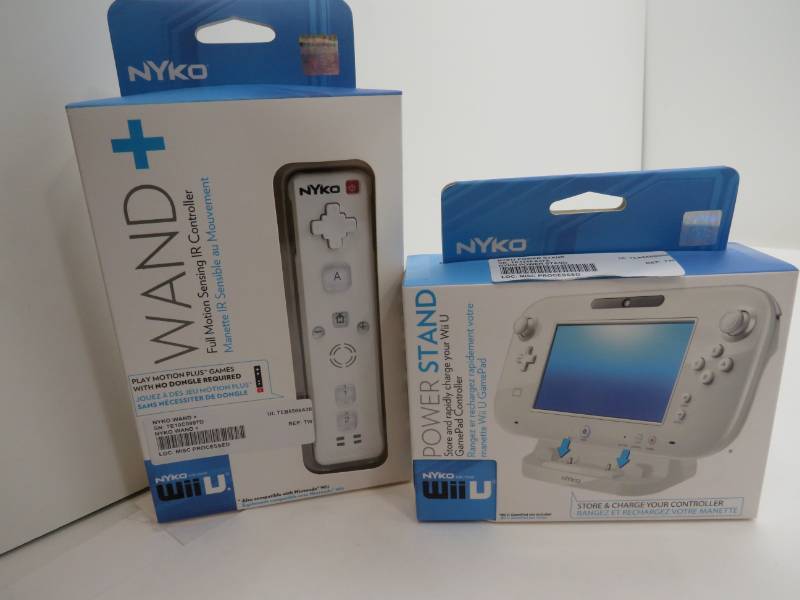 lot 28 image: White Gamer package with a controller and a power stand