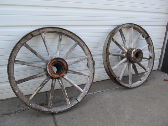 lot 83 image: Pair of Antique IronWooden Wagon Wheels wHubs