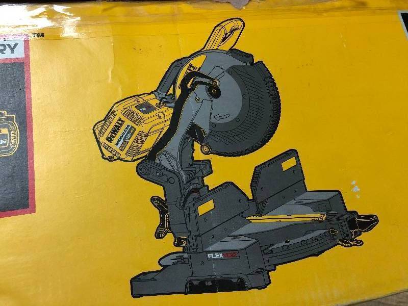 lot 106 image: DEWALT FLEXVOLT 120-Volt MAX Lithium-Ion Cordless Brushless 12 in. Sliding Miter Saw w AC Adapter tool only  in good conditions