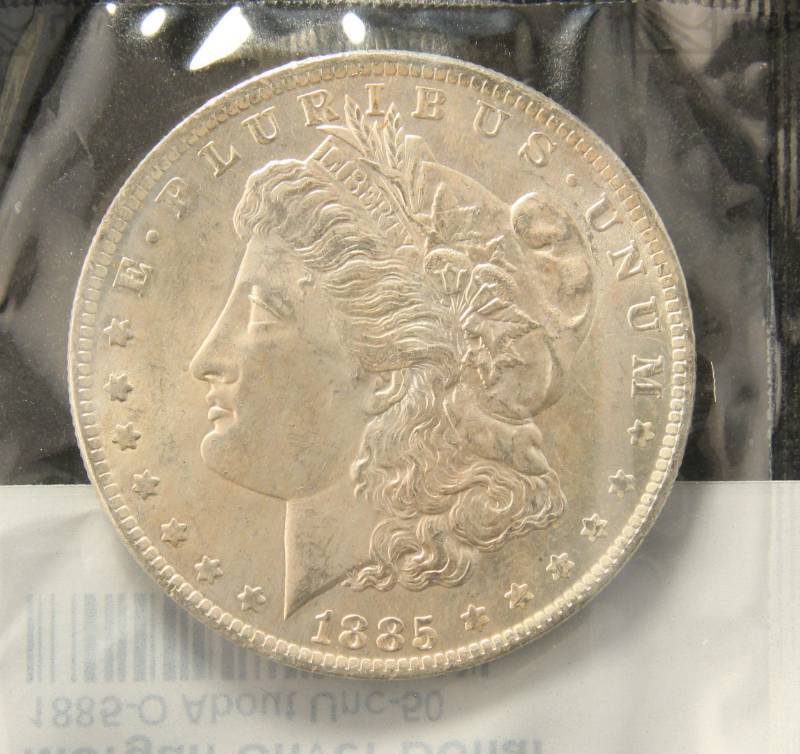 lot 56 image: 1885-O MORGAN SILVER DOLLAR AU SEALED LITTLETON